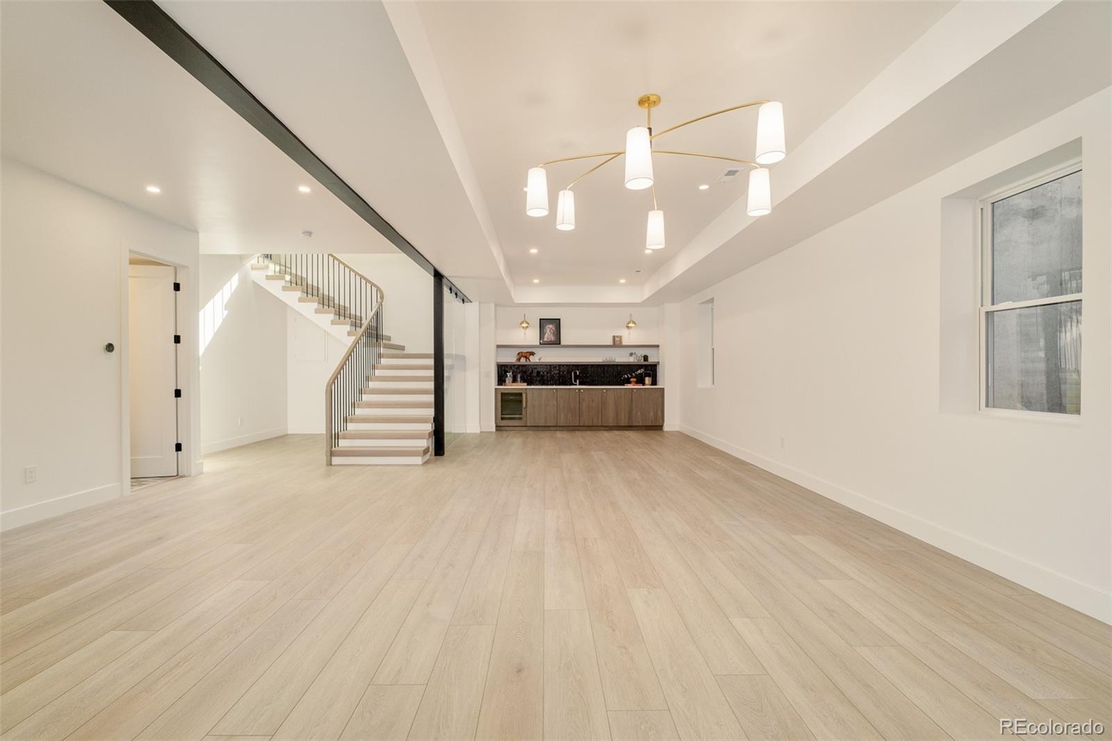 1253 South High Street Denver, CO 80210 - Photo 34 of 46 a view of a livingroom with stairs