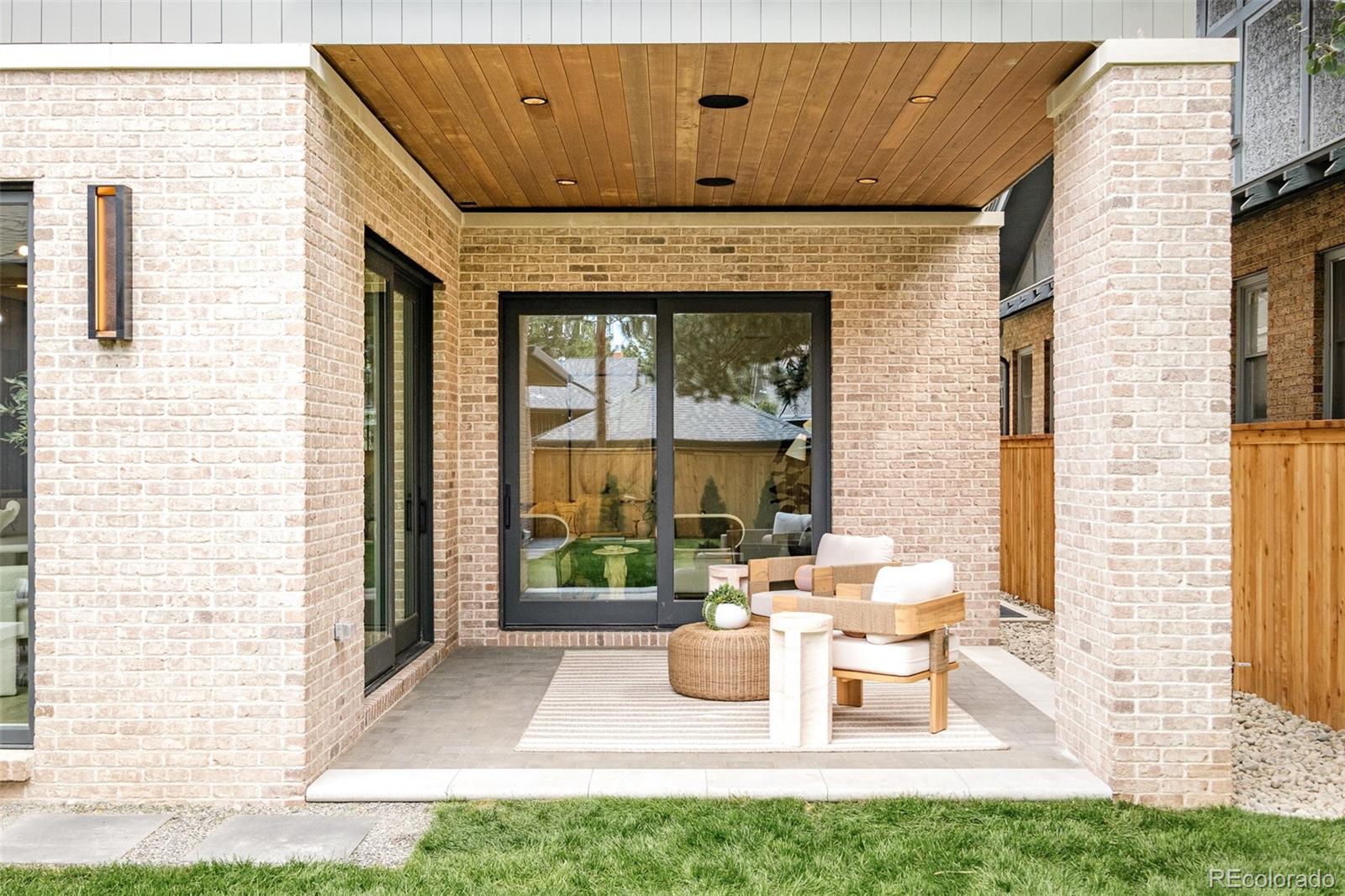 1253 South High Street Denver, CO 80210 - Photo 39 of 46 a view of a patio with table and chairs and potted plants