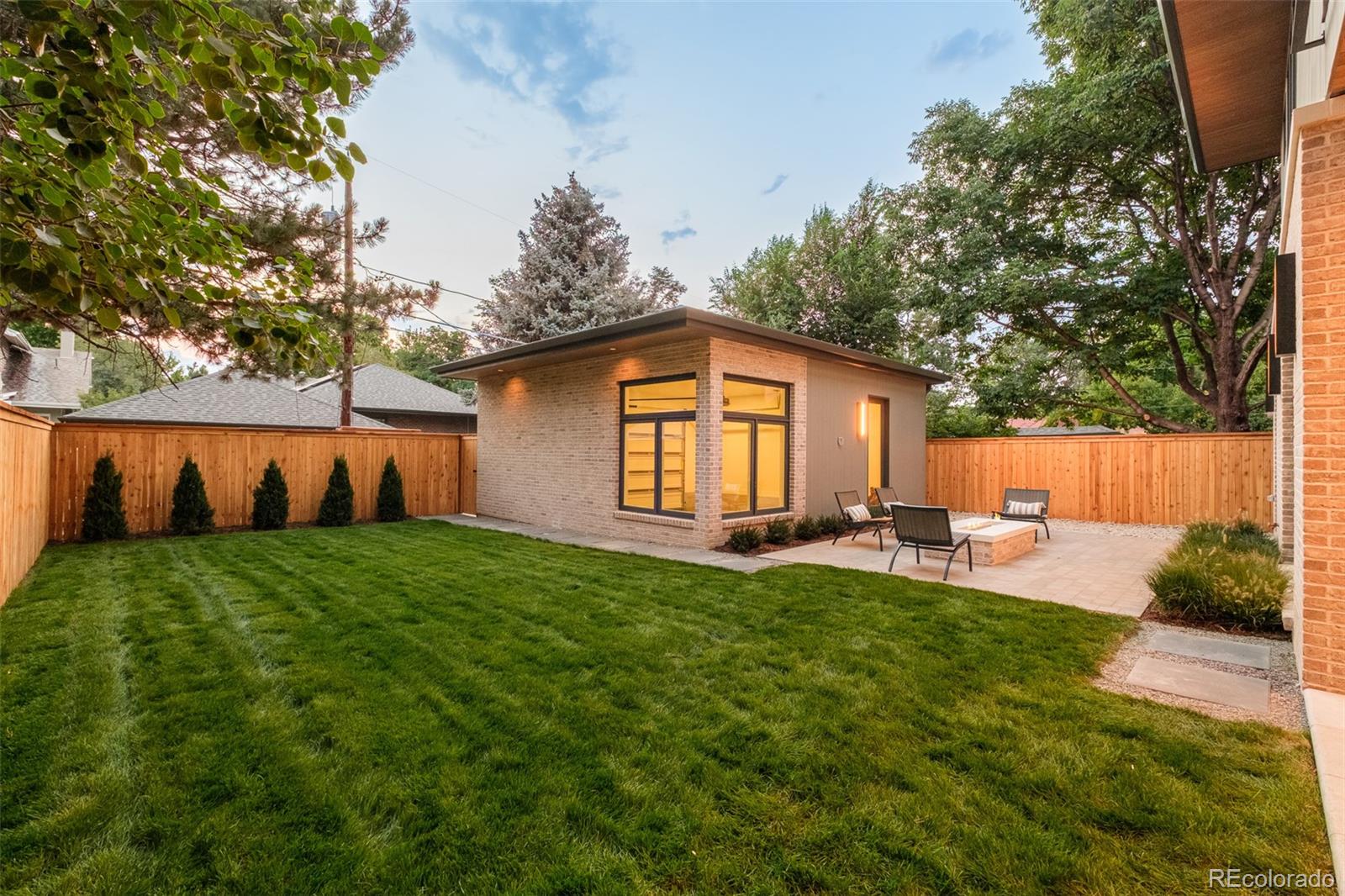 1253 South High Street Denver, CO 80210 - Photo 42 of 46 a view of a house with backyard and sitting area
