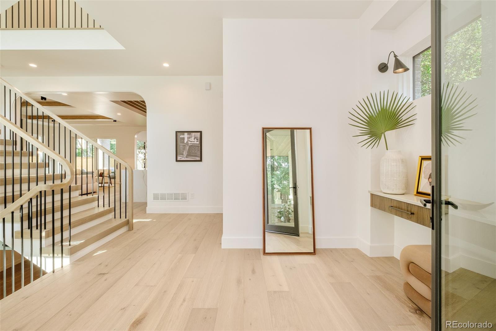 1253 South High Street Denver, CO 80210 - Photo 7 of 46 a view of entryway with wooden floor