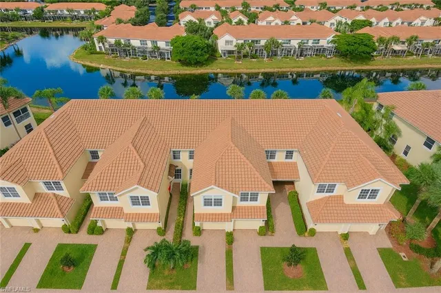 an aerial view of a house with a lake view