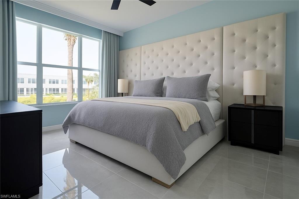 1320 Henley Street, Unit 2003 Naples, FL 34105 - Photo 12 of 36 a large bedroom with a bed and a window