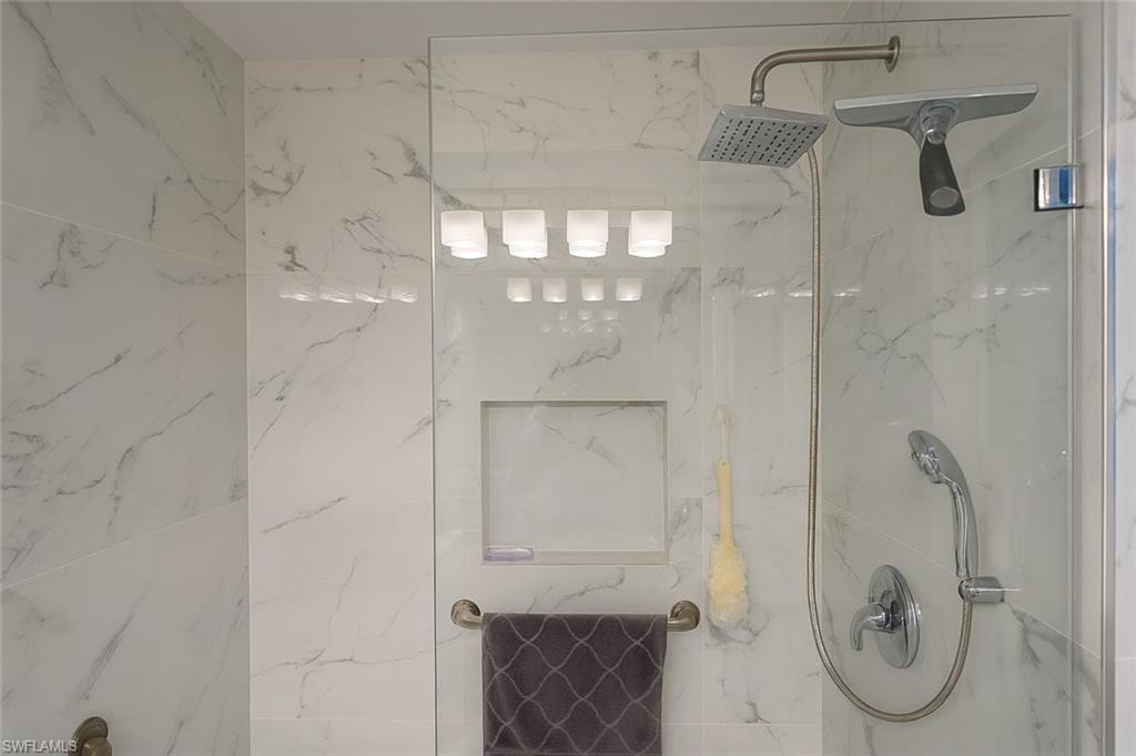 1320 Henley Street, Unit 2003 Naples, FL 34105 - Photo 24 of 36 a bathroom with a glass shower door