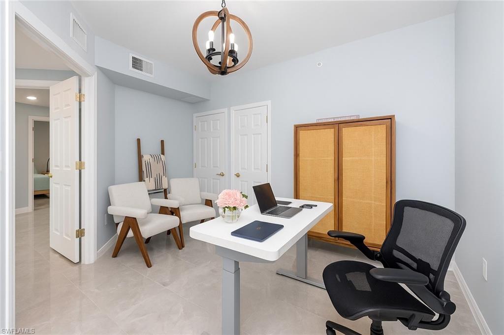 1320 Henley Street, Unit 2003 Naples, FL 34105 - Photo 26 of 36 a work room with furniture and a window