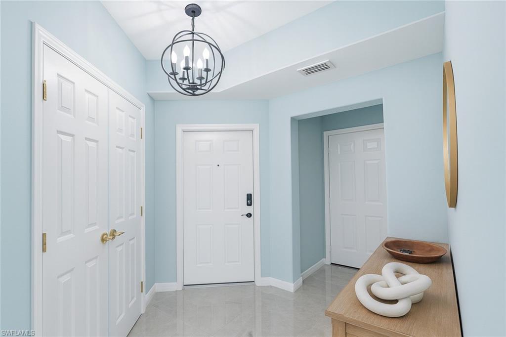 1320 Henley Street, Unit 2003 Naples, FL 34105 - Photo 28 of 36 a room with water heater and view kitchen