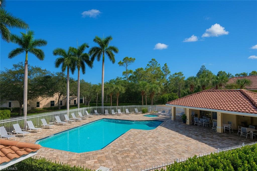 1320 Henley Street, Unit 2003 Naples, FL 34105 - Photo 32 of 36 a view of a house with swimming pool and sitting area
