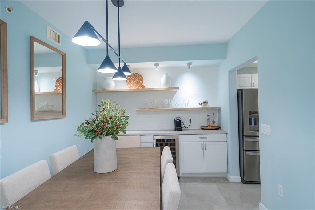 1320 Henley Street, Unit 2003 Naples, FL 34105 - Photo 4 of 36 a kitchen with a refrigerator and a sink