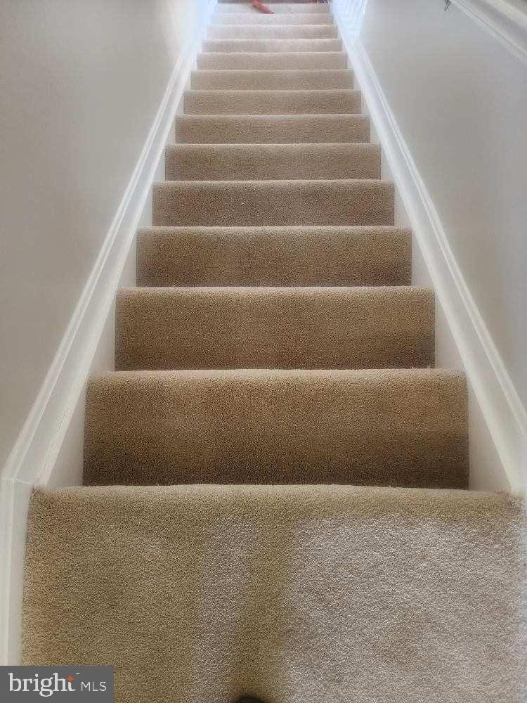 13901 King Gregory Way, Unit 391 Upper Marlboro, MD 20772 - Photo 13 of 14 a view of staircase with empty racks