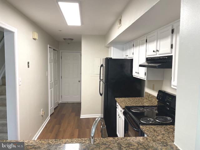 13901 King Gregory Way, Unit 391 Upper Marlboro, MD 20772 - Photo 2 of 14 a kitchen with stainless steel appliances granite countertop a refrigerator and a stove