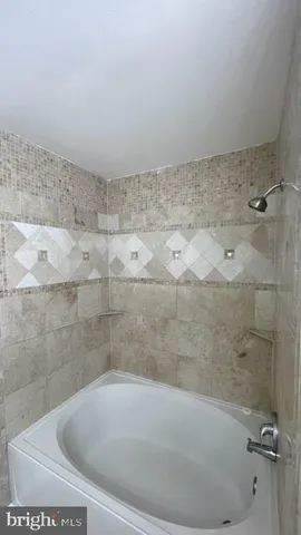 a view of a bathtub in a bathroom