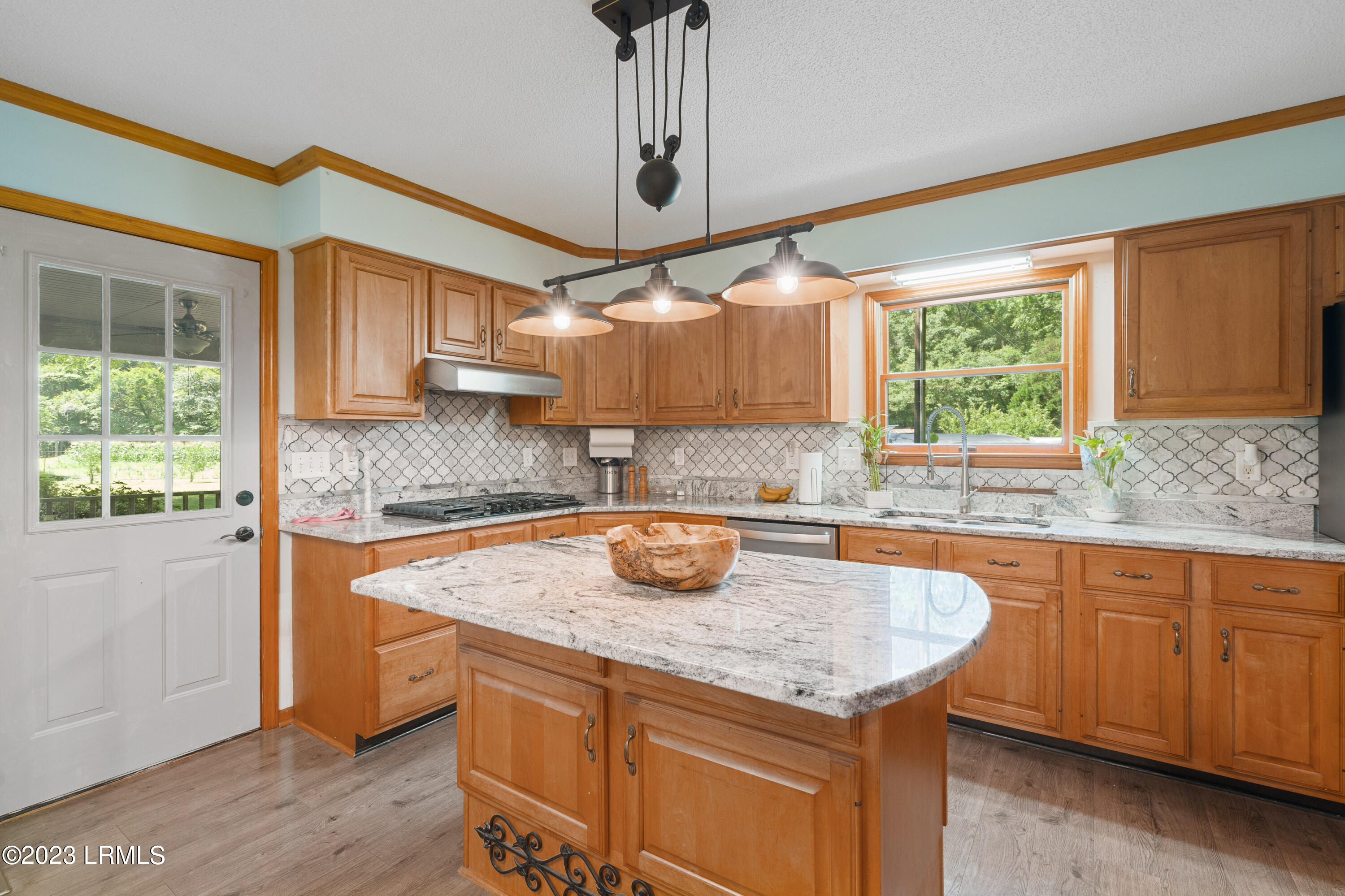176 State Rd S-7-594 Beaufort, SC 29906 - Photo 14 of 42 Kitchen and door to porch