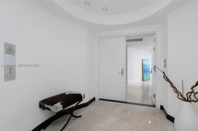 a room with a chair and a rug