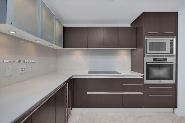 a kitchen with a stove and a microwave