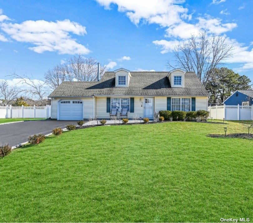 7 Cedar Ridge Drive Ridge, NY 11961 - Photo 1 of 1 a front view of a residential houses with yard and green space