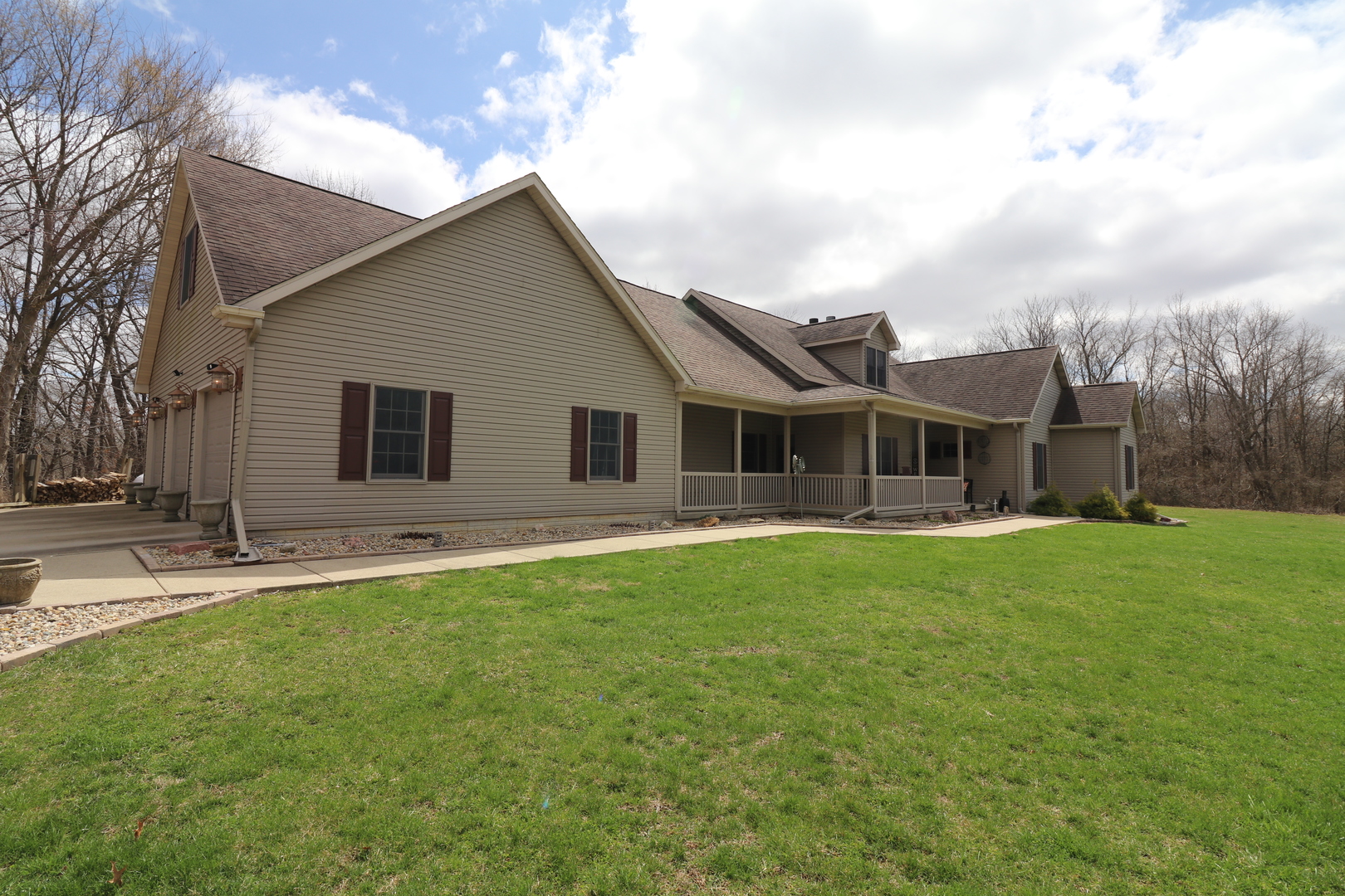 16682 Parnell Road Dewitt, IL 61735 - Photo 3 of 63 a front view of house with yard barbeque and outdoor seating