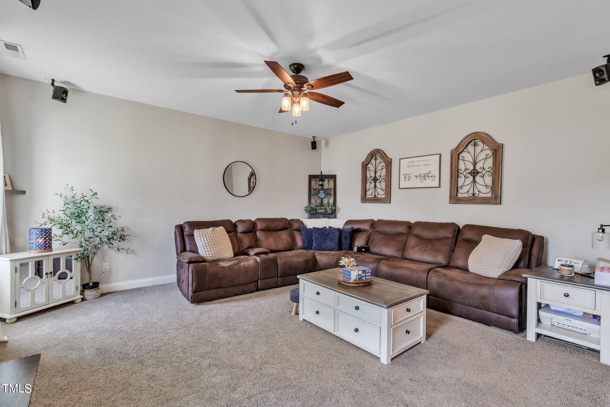 111 Oldstead Drive Raeford, NC 28376 - Photo 16 of 28 a living room with furniture and a ceiling fan