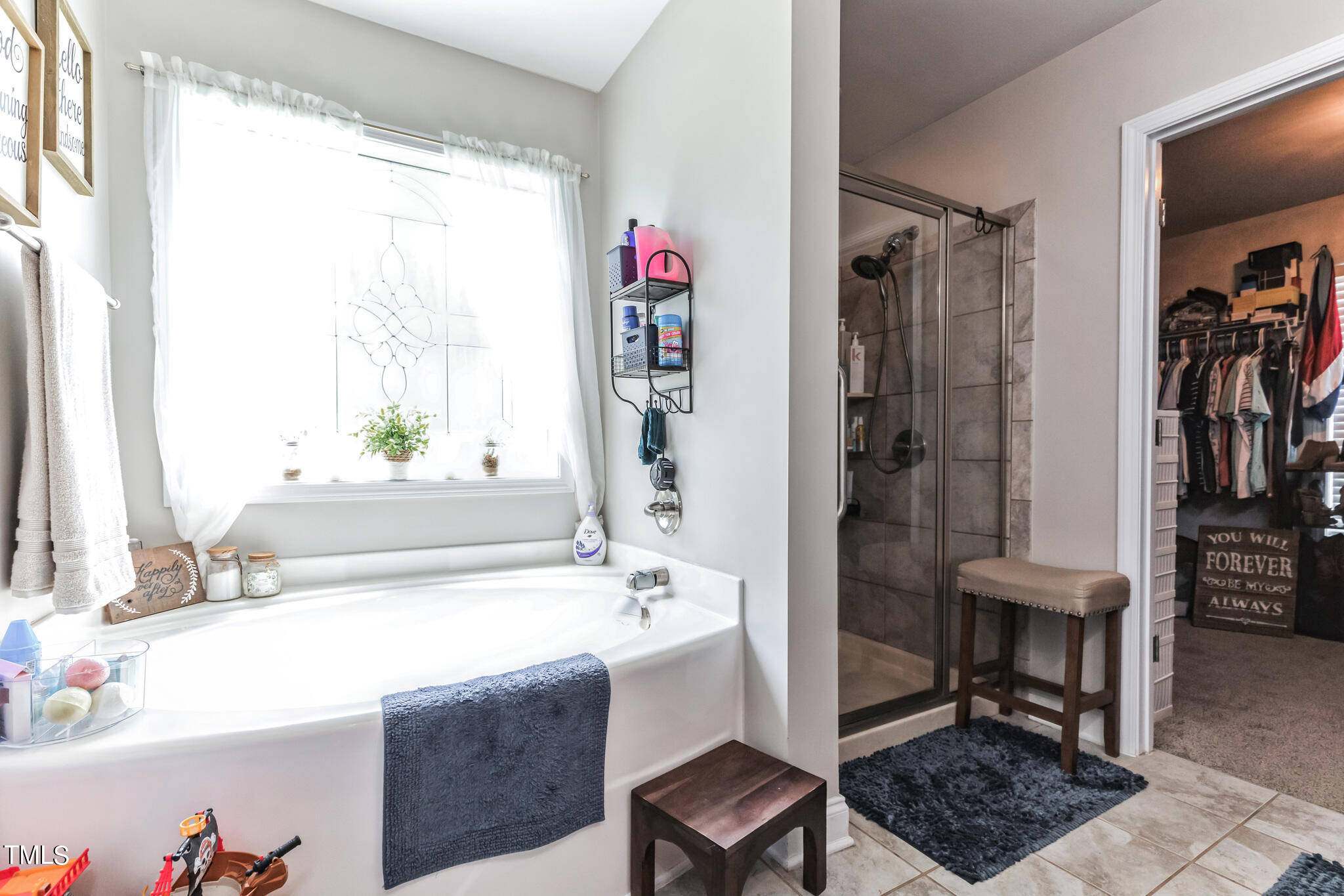 111 Oldstead Drive Raeford, NC 28376 - Photo 20 of 28 a bathroom with a bathtub a sink and a window