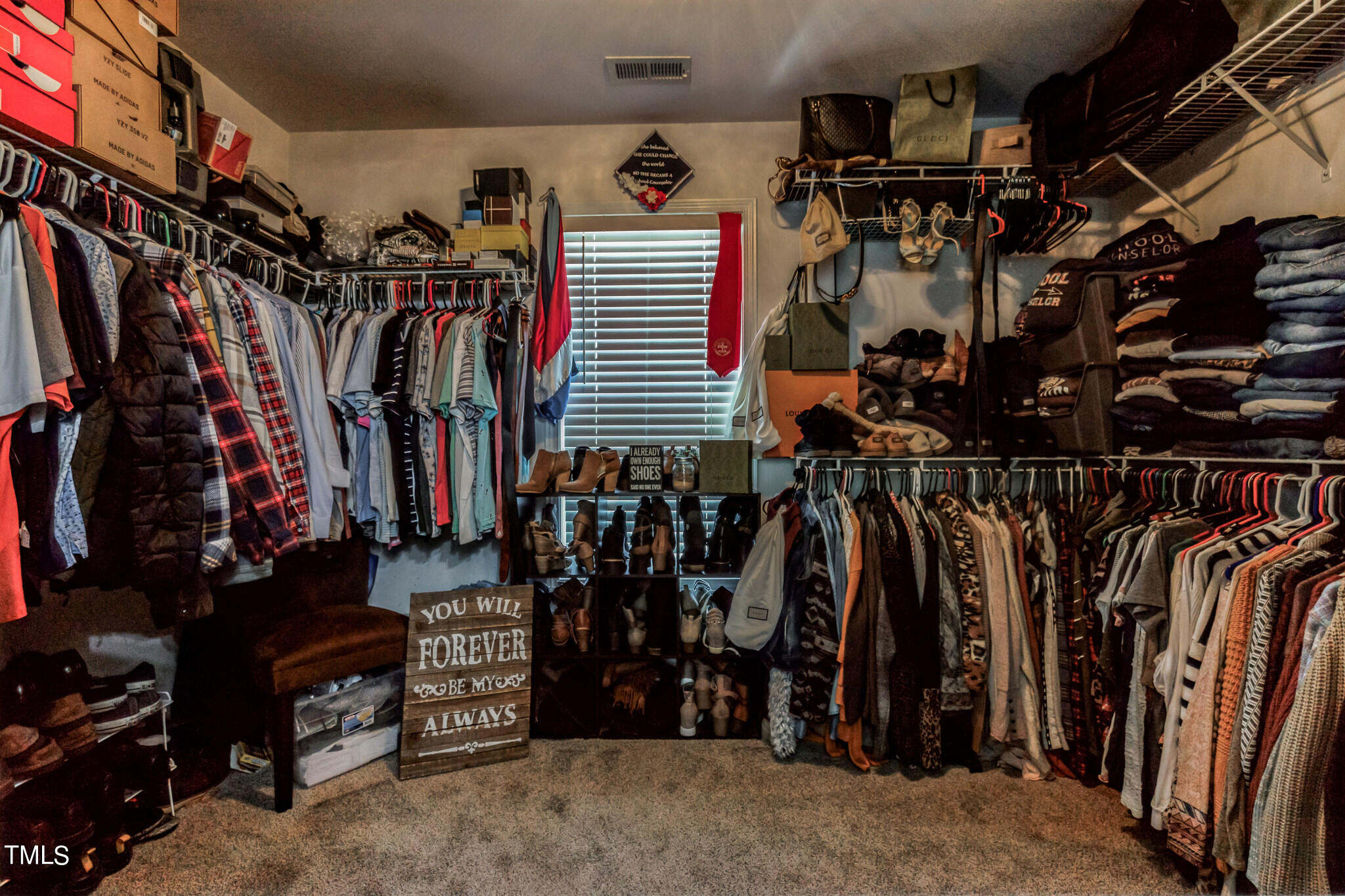 111 Oldstead Drive Raeford, NC 28376 - Photo 21 of 28 a view of walk in closet with clothes and shoes