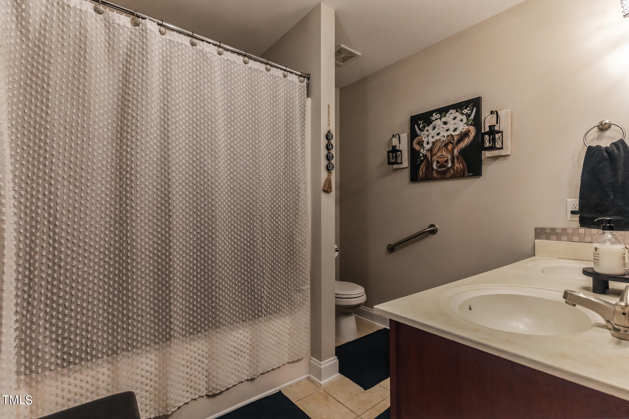 111 Oldstead Drive Raeford, NC 28376 - Photo 22 of 28 a bathroom with a sink and a mirror