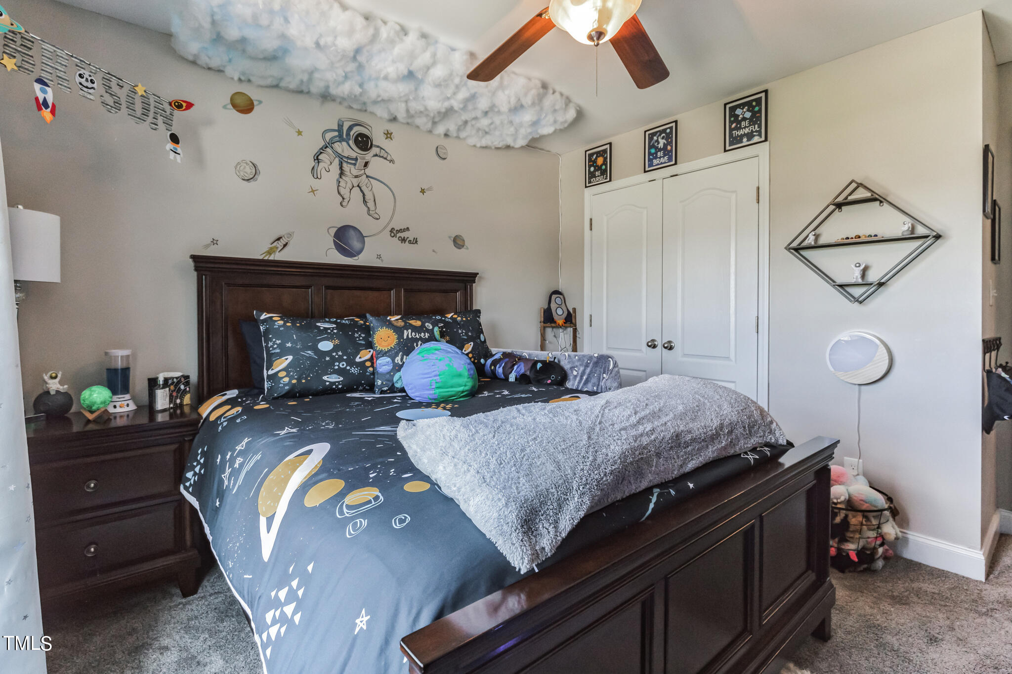 111 Oldstead Drive Raeford, NC 28376 - Photo 23 of 28 a bed sitting in a bedroom next to a lamp