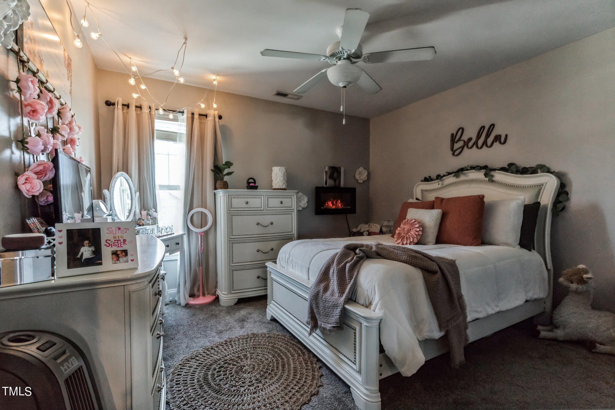 111 Oldstead Drive Raeford, NC 28376 - Photo 24 of 28 a bedroom with a bed a couch and a chandelier
