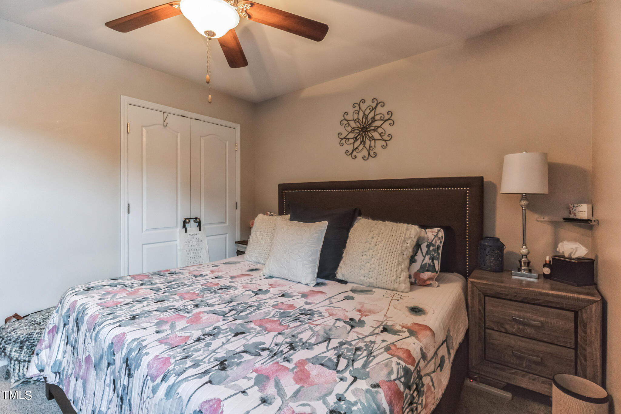 111 Oldstead Drive Raeford, NC 28376 - Photo 26 of 28 a bedroom with a large bed and a chandelier