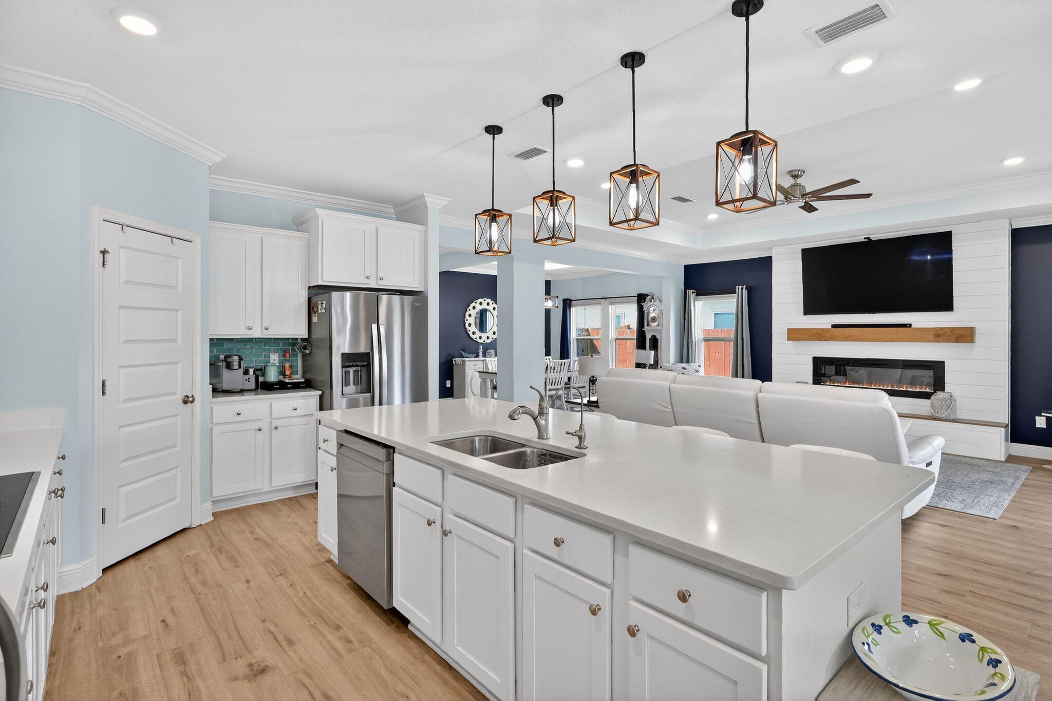 27 Oak Trees Lane East Freeport, FL 32439 - Photo 11 of 33 a view of living room kitchen with stainless steel appliances granite countertop living room
