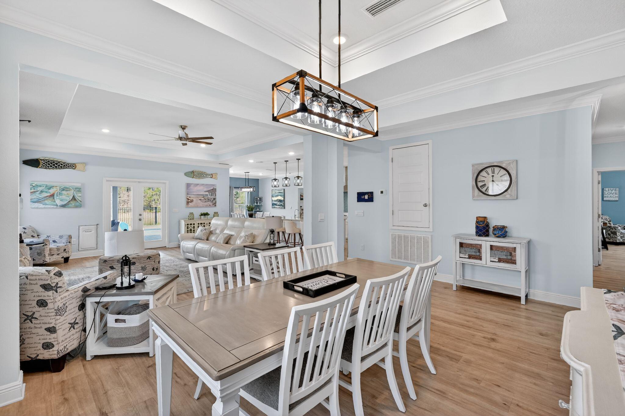 27 Oak Trees Lane East Freeport, FL 32439 - Photo 13 of 33 a view of a dining room with furniture window and wooden floor