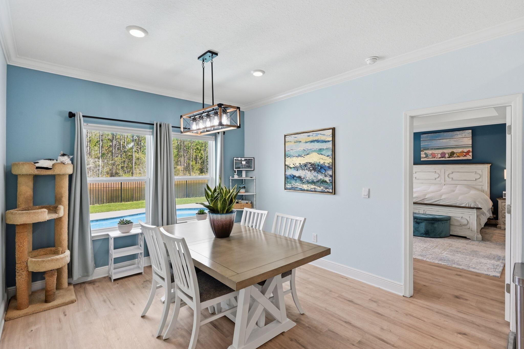 27 Oak Trees Lane East Freeport, FL 32439 - Photo 16 of 33 a view of a dining room with furniture window and wooden floor