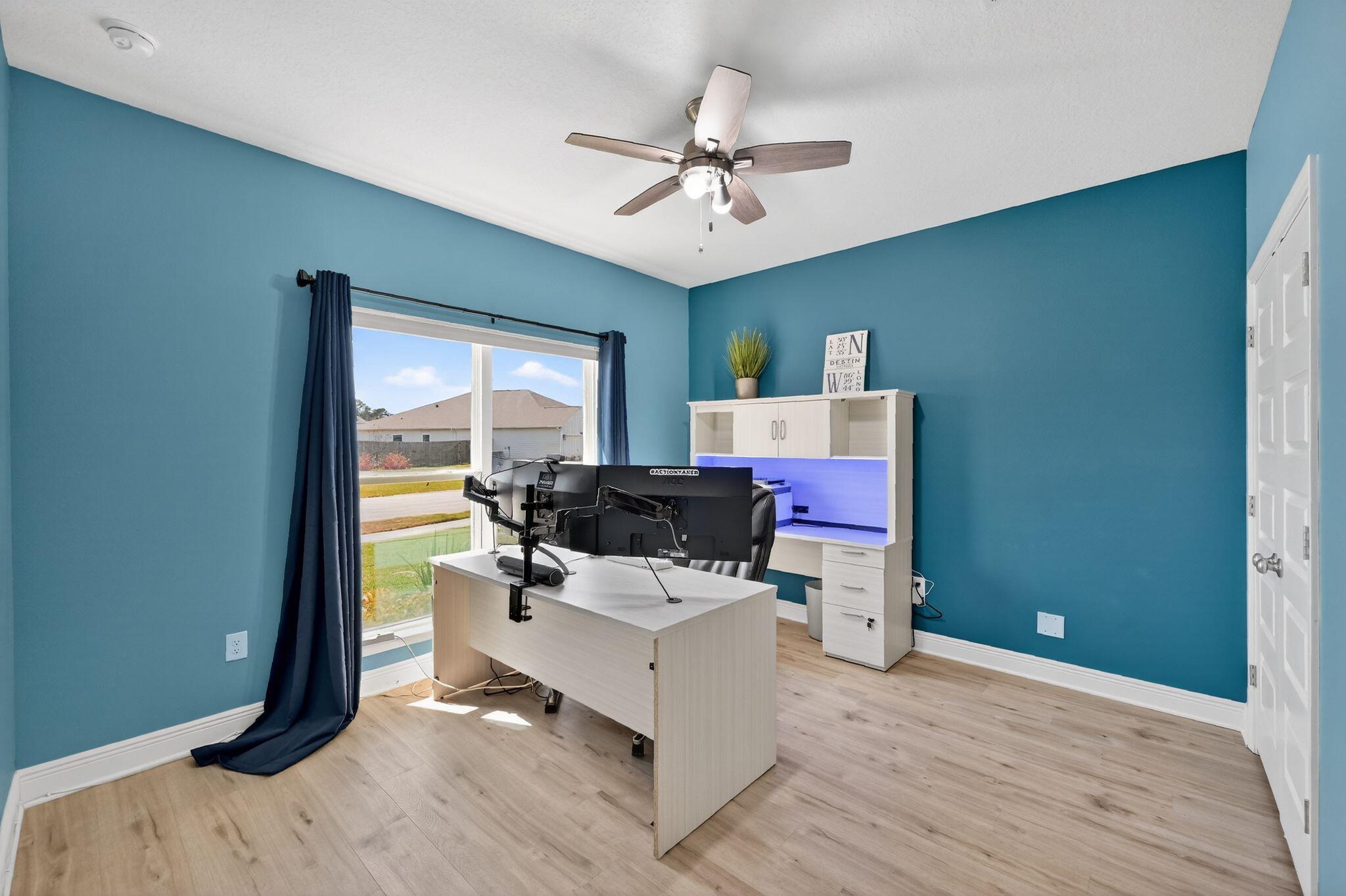 27 Oak Trees Lane East Freeport, FL 32439 - Photo 20 of 33 a living room with furniture and a large window