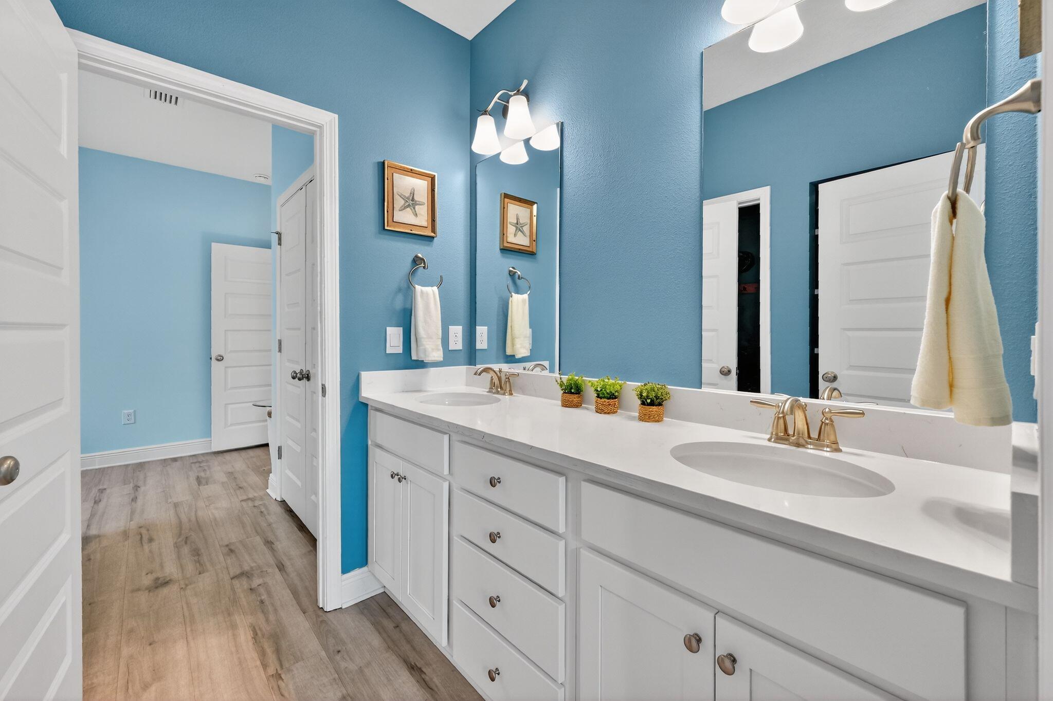 27 Oak Trees Lane East Freeport, FL 32439 - Photo 22 of 33 a bathroom with a double vanity sink and a mirror