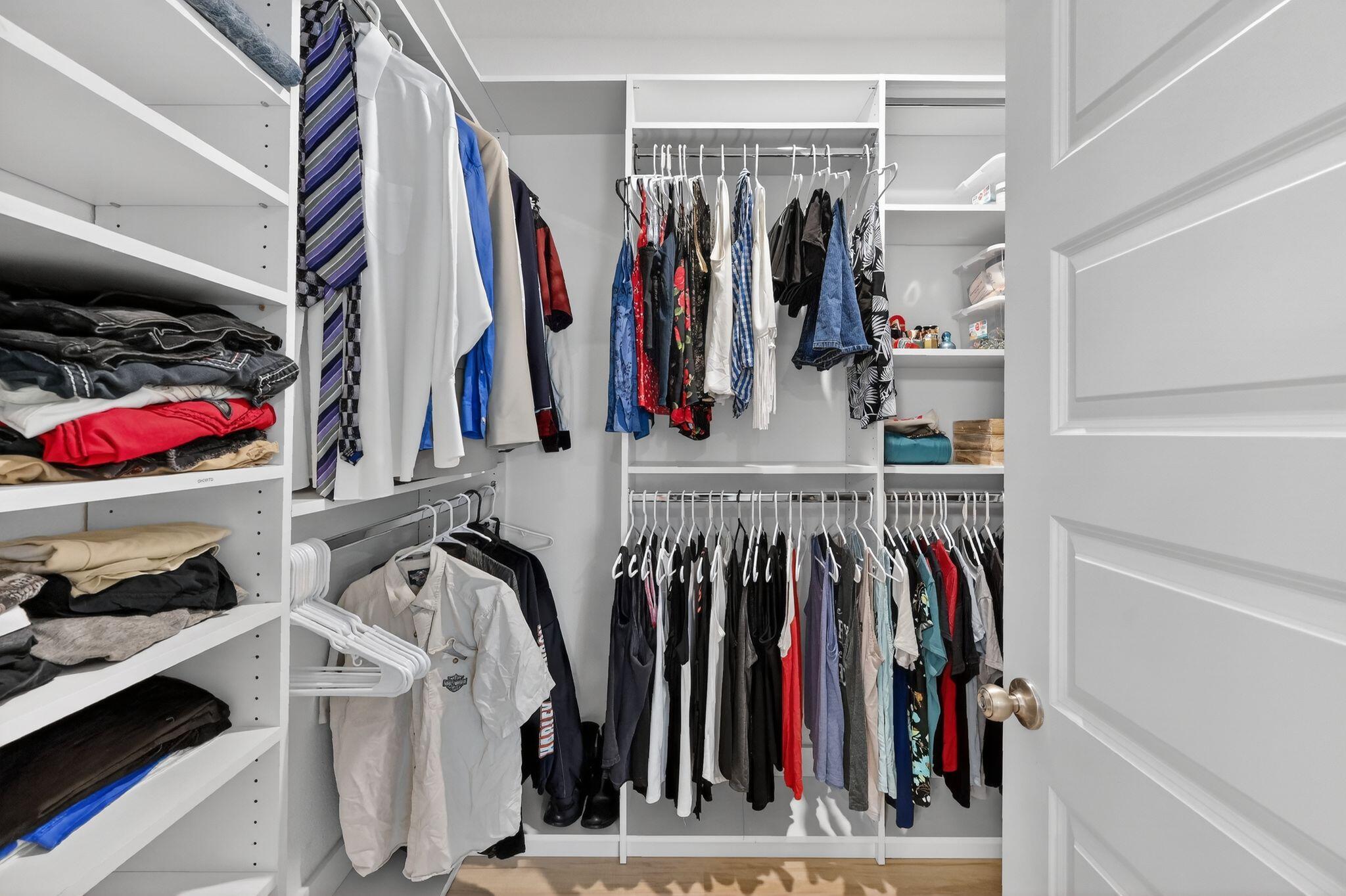 27 Oak Trees Lane East Freeport, FL 32439 - Photo 32 of 33 a view of walk in closet with clothes
