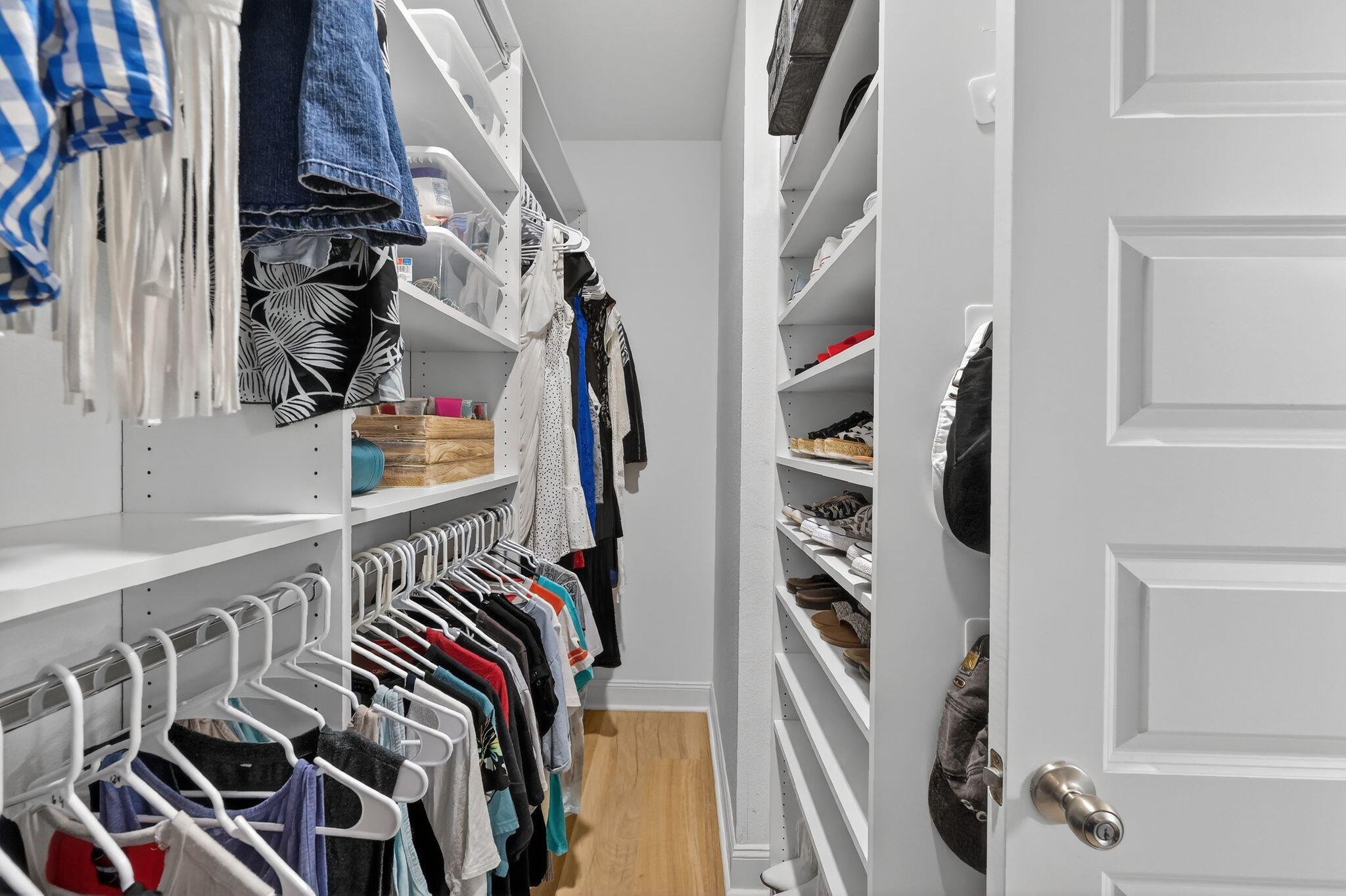 27 Oak Trees Lane East Freeport, FL 32439 - Photo 33 of 33 a view of walk in closet with clothes and shoes