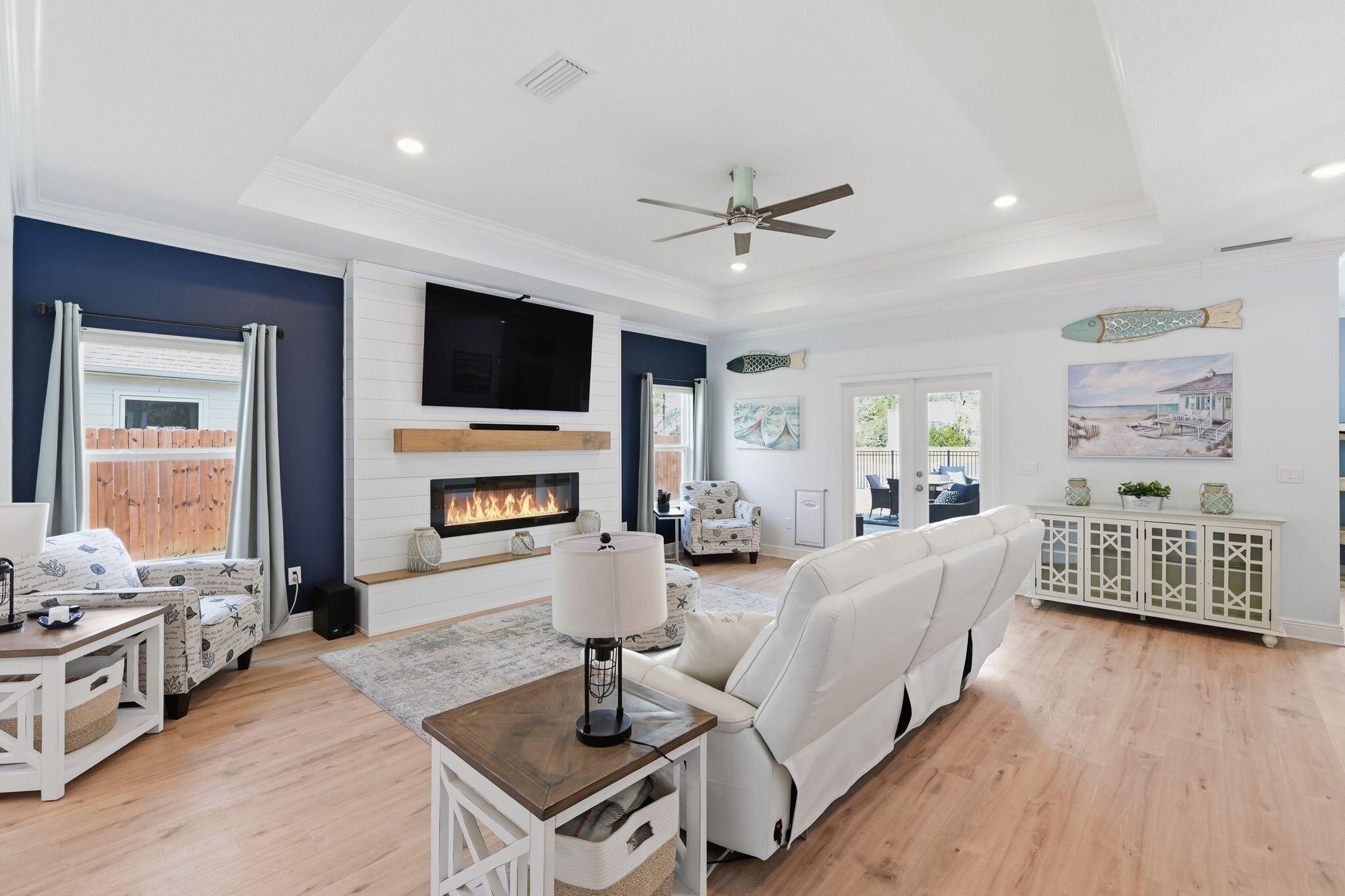 27 Oak Trees Lane East Freeport, FL 32439 - Photo 5 of 33 a living room with fireplace furniture and a flat screen tv