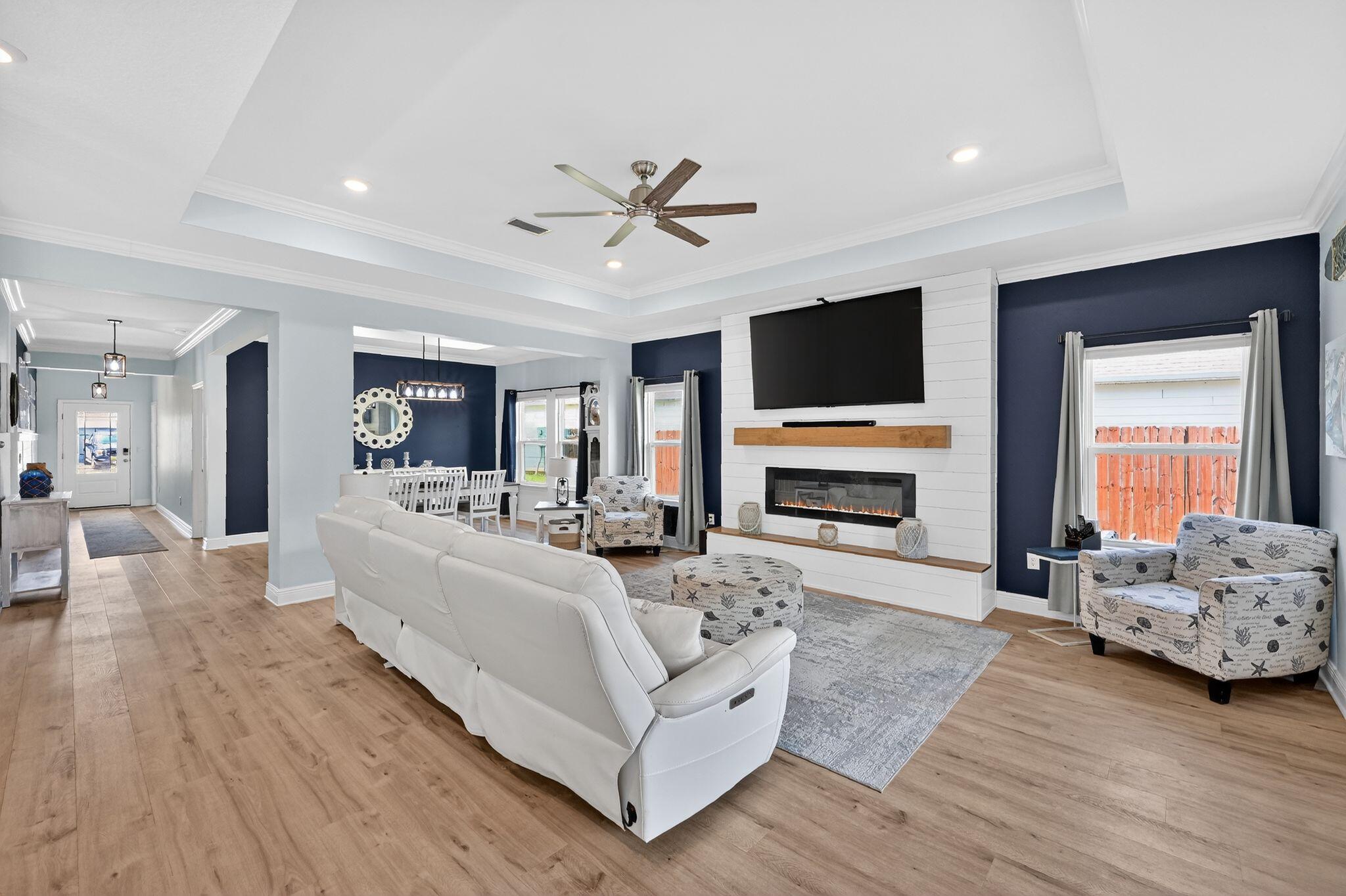 27 Oak Trees Lane East Freeport, FL 32439 - Photo 7 of 33 a living room with furniture fireplace and flat screen tv