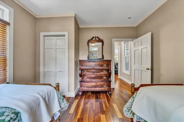 a bedroom with a bed and ceiling fan