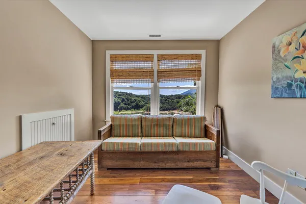 a living room with furniture pool table and table