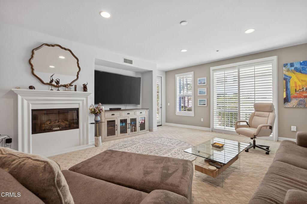 1423 Windshore Way Oxnard, CA 93035 - Photo 25 of 77 a living room with furniture and a flat screen tv