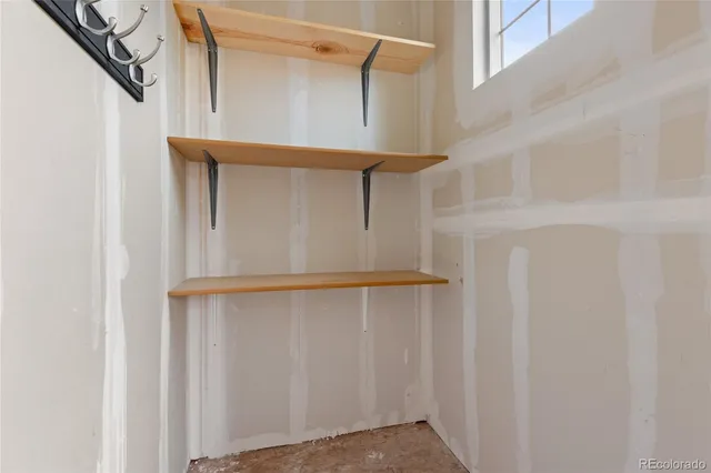 an aerial view of a house with a swimming pool