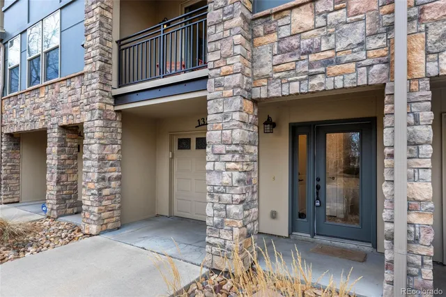 front view of a brick house with a large window