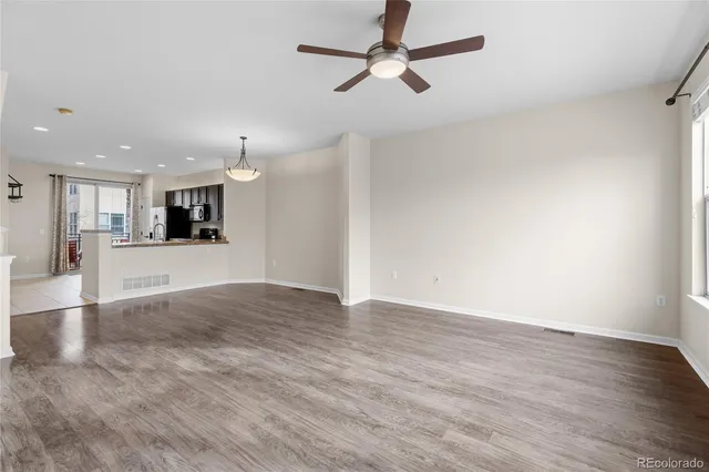 a view of a kitchen with a dishwasher cabinets and wooden floor