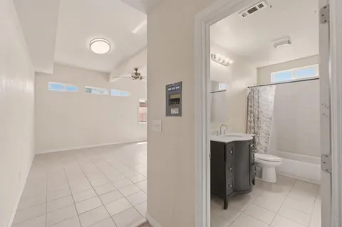 a bathroom with a shower and a toilet