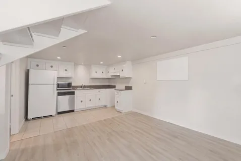 a view of kitchen with wooden floor