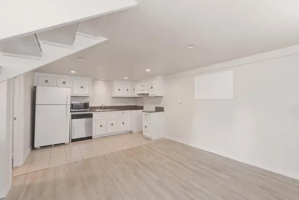 a view of kitchen with wooden floor