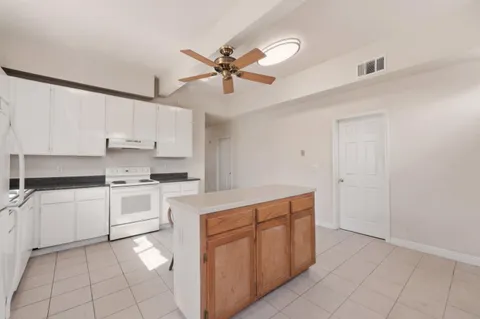 a kitchen with stainless steel appliances a sink and cabinets