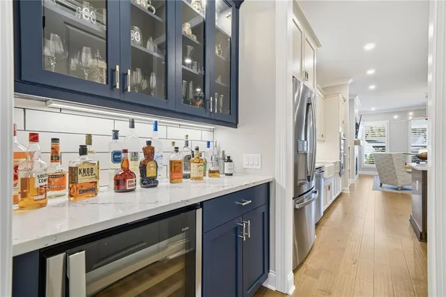 a kitchen with a sink stove and refrigerator
