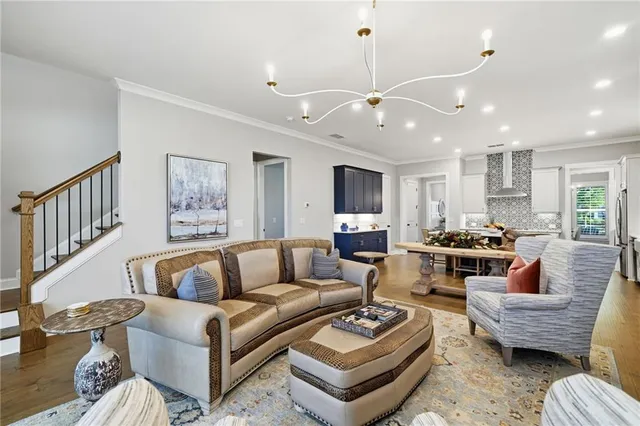 a spacious bathroom with a double vanity sink a large mirror a shower and a bathtub