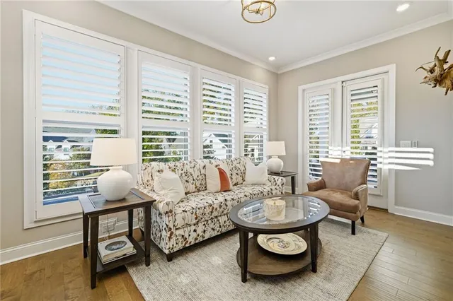 a bathroom with a granite countertop sink a mirror and shower