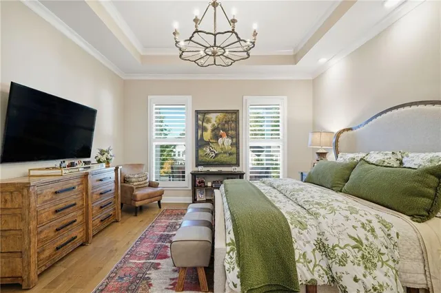 a bathroom with a toilet a sink a mirror and a shower