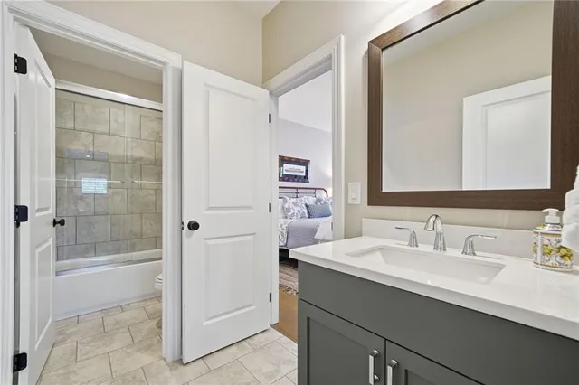 a view of a patio with a table and chairs under an umbrella